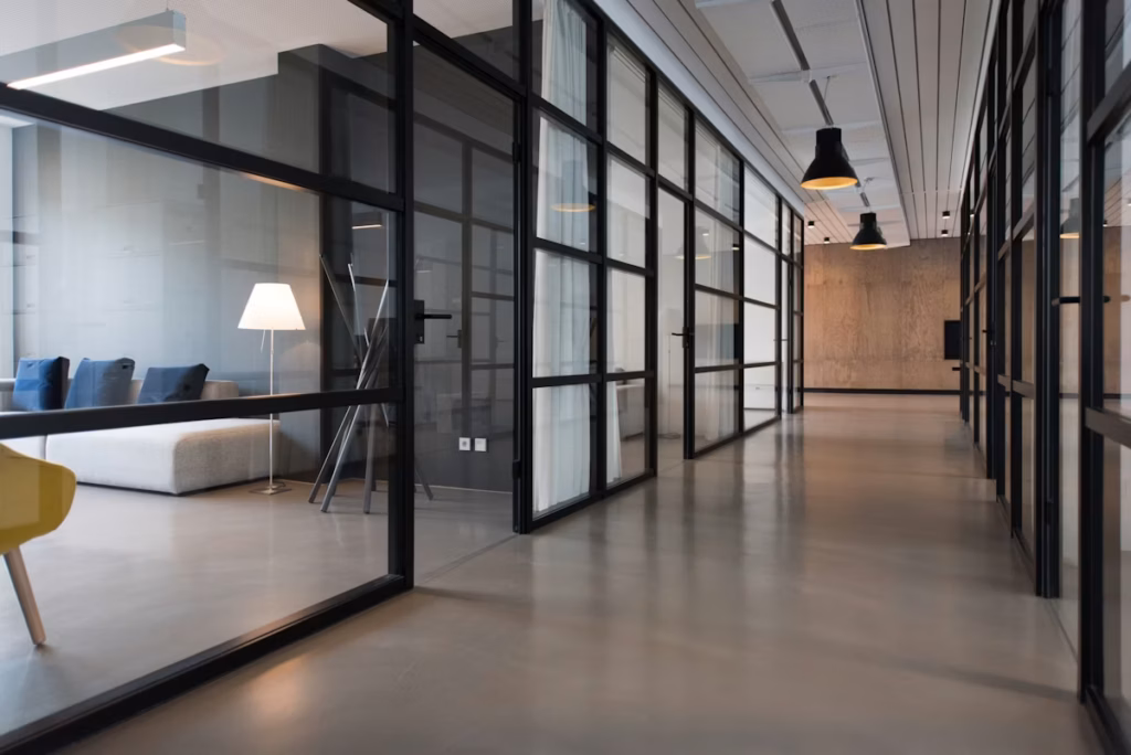 Modern open-plan engineering workspace with desks and natural light
